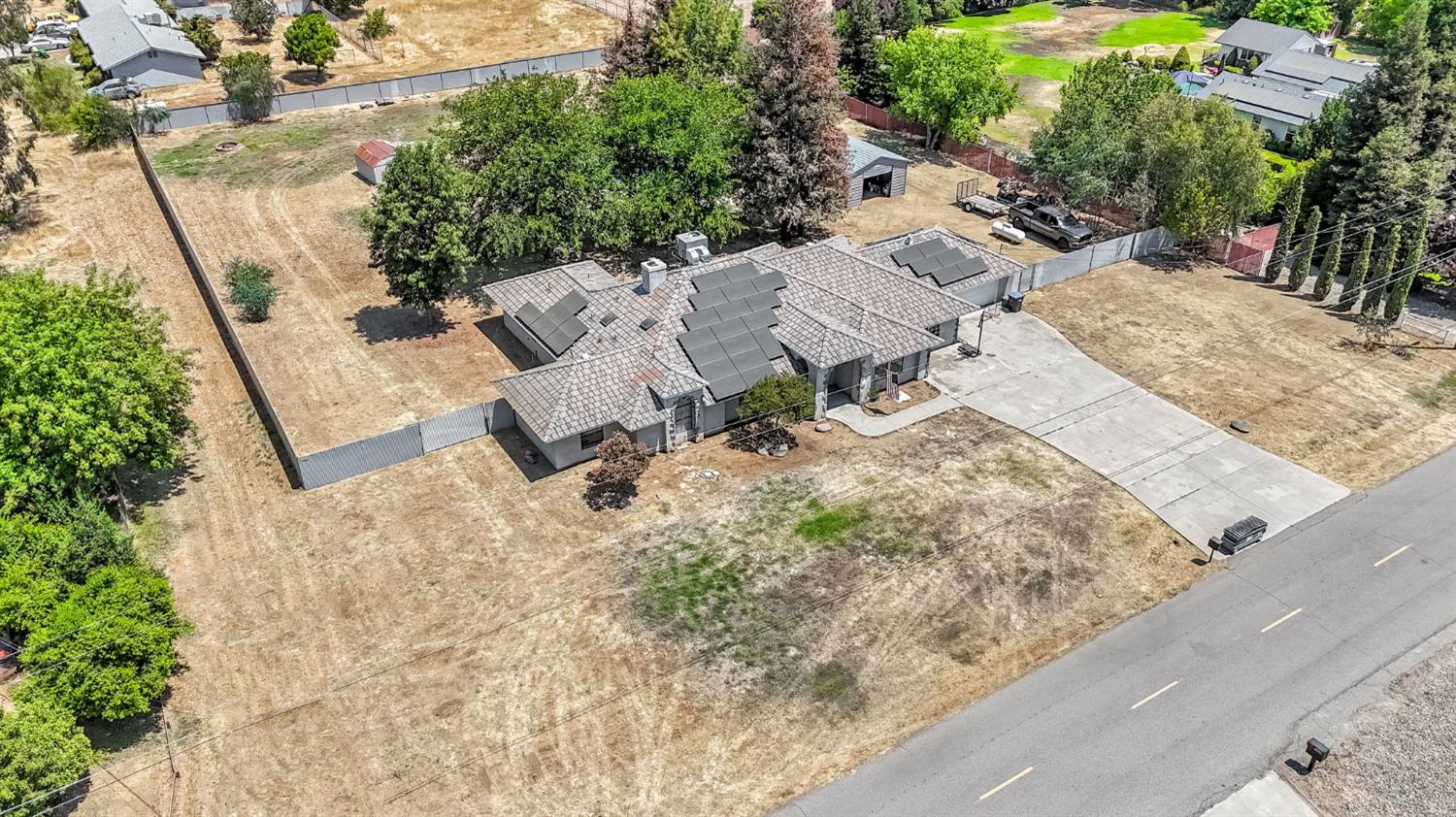 36065 Manon Avenue Madera, CA 93636 - Photo 44 of 50 an aerial view of residential house with outdoor space