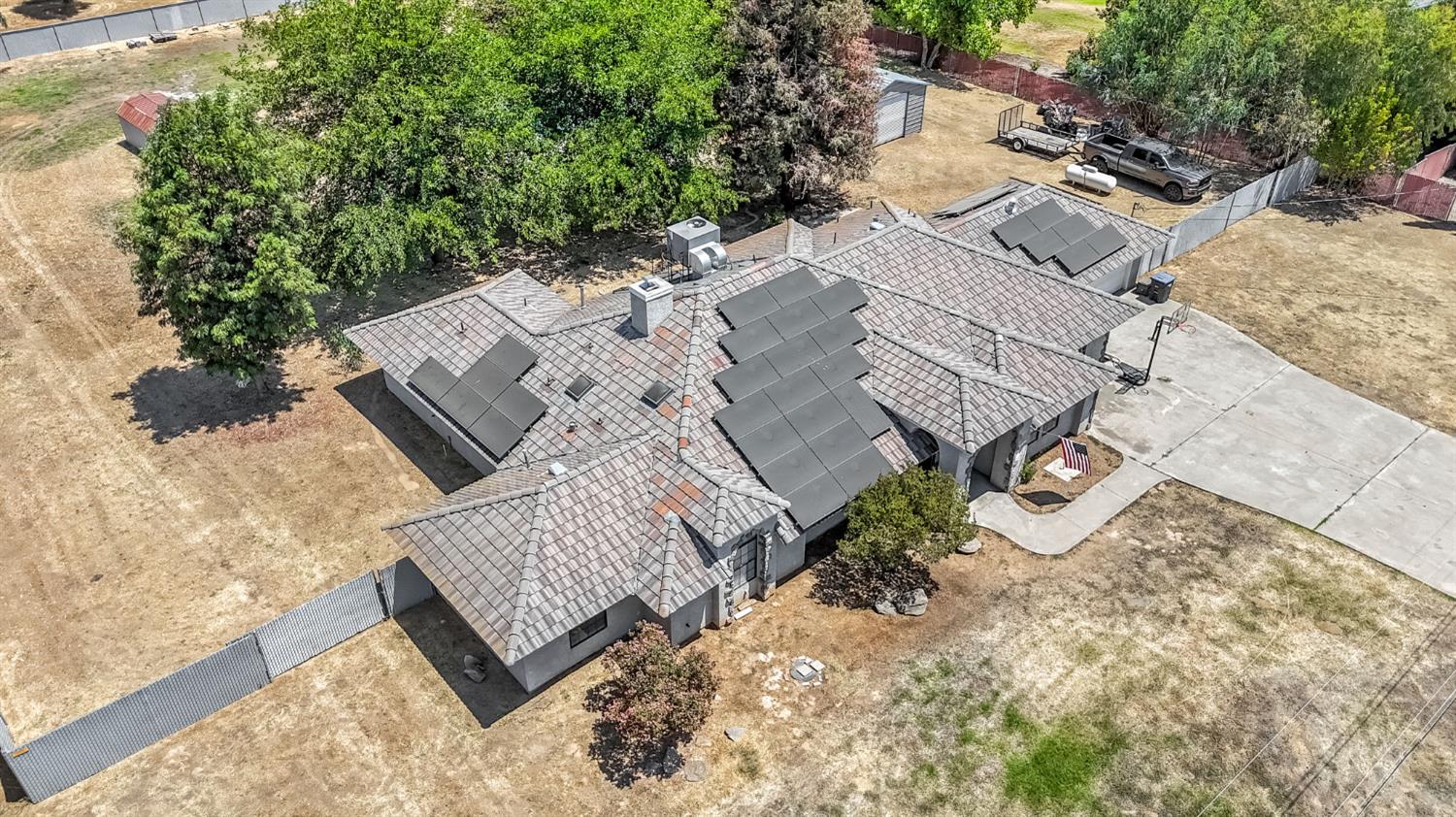 36065 Manon Avenue Madera, CA 93636 - Photo 48 of 50 an aerial view of a house with a yard