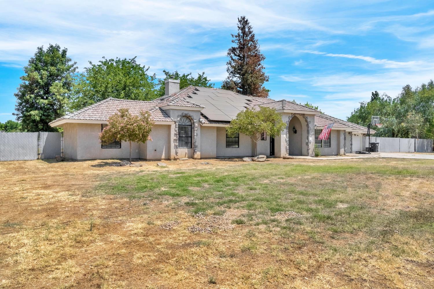 36065 Manon Avenue Madera, CA 93636 - Photo 49 of 50 a front view of a house with a garden