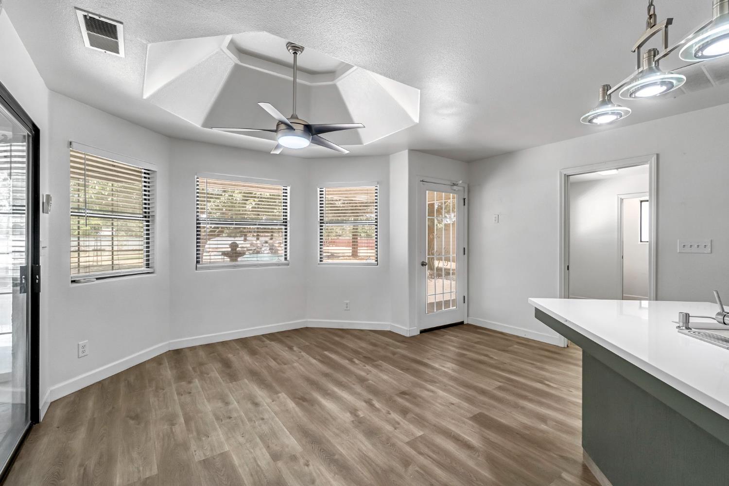 36065 Manon Avenue Madera, CA 93636 - Photo 7 of 50 wooden floor in an empty room with a window