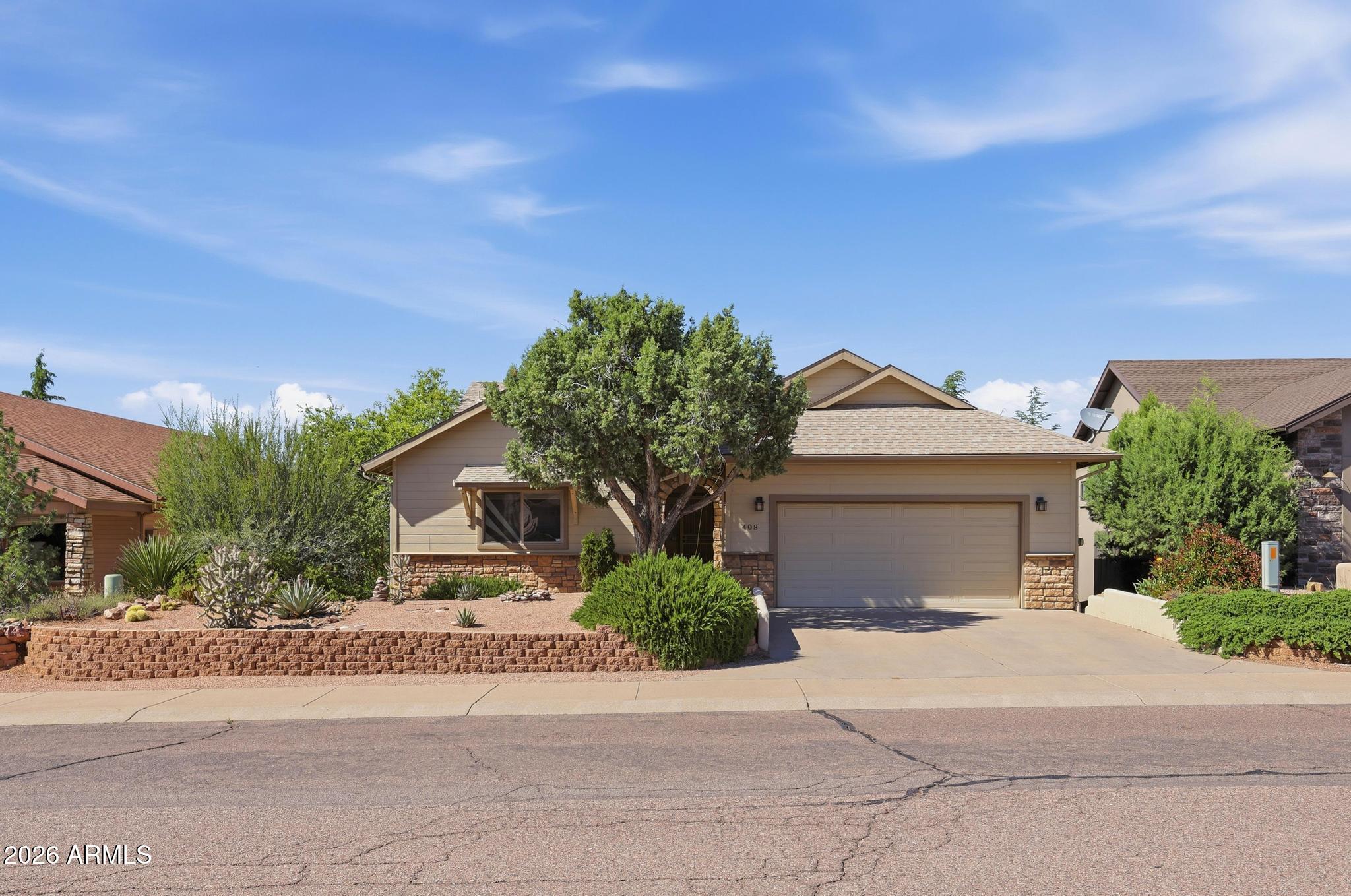 408 East Phoenix Street Payson, AZ 85541 - Photo 3 of 35 a front view of a house with a yard and garage