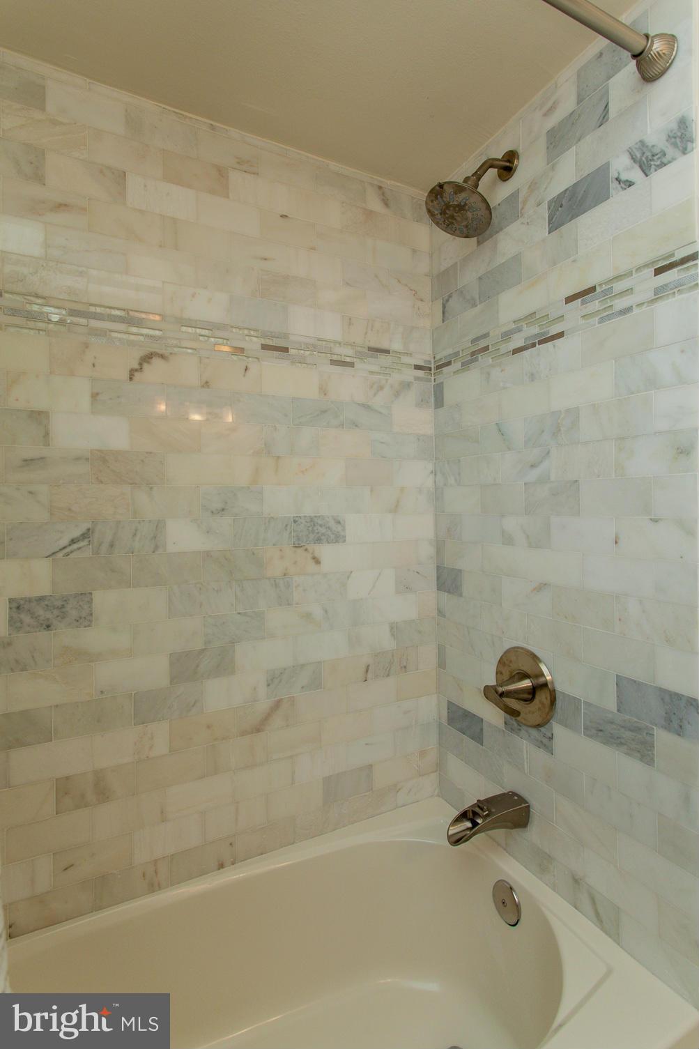 1339 Stonewood Road Baltimore, MD 21239 - Photo 14 of 17 a bathroom with a bathtub
