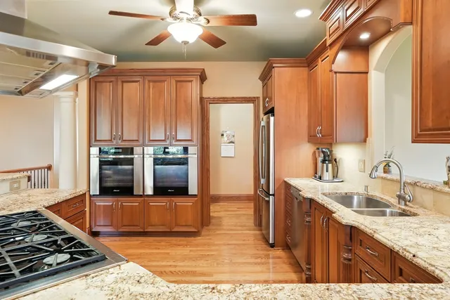 a living room with fireplace furniture and a large window