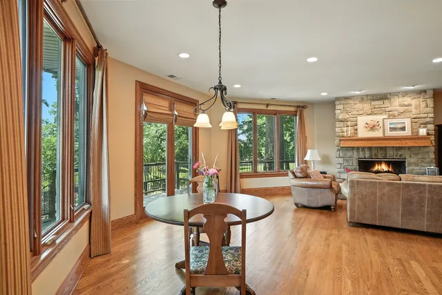 a living room with furniture and floor to ceiling windows