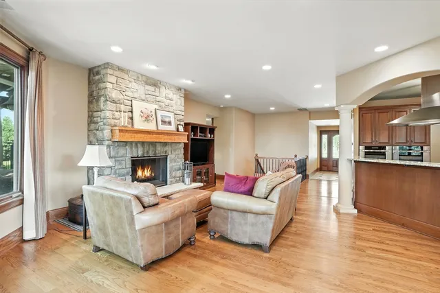 a view of a hallway view with wooden floor and staircase