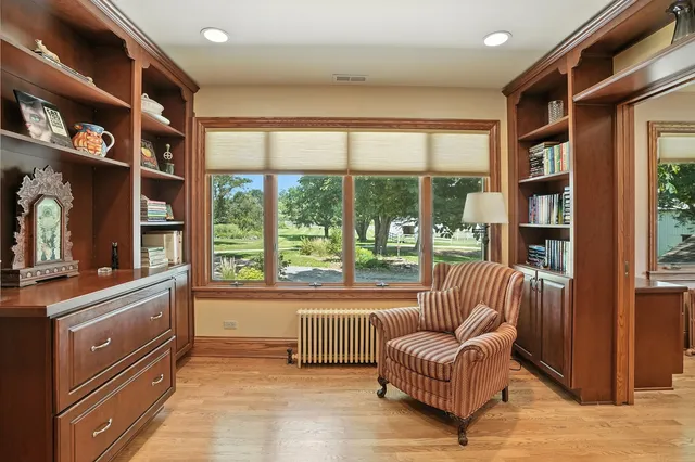 a bathroom with a tub a sink and a mirror
