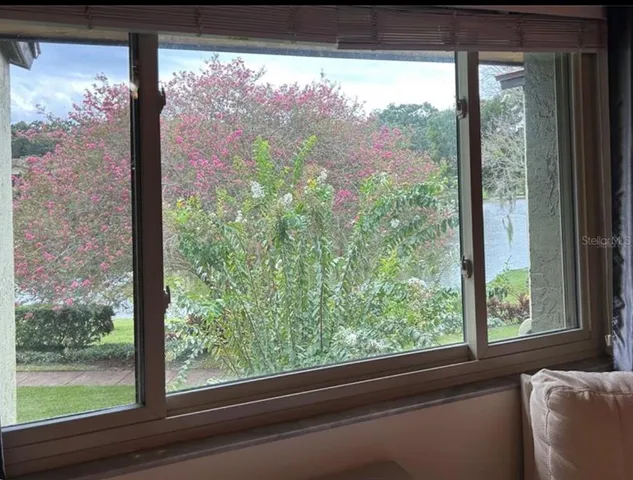 a view of a room with a large window