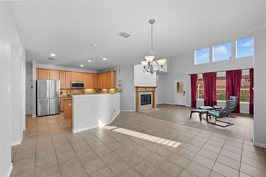 11577 Mansfield Drive Frisco, TX 75035 - Photo 15 of 37 a view of a kitchen with dining table and chairs