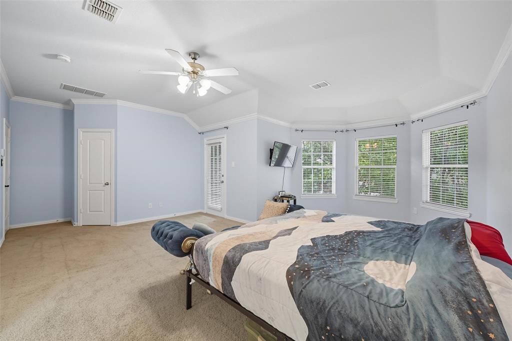 11577 Mansfield Drive Frisco, TX 75035 - Photo 24 of 37 a bedroom with a bed and window