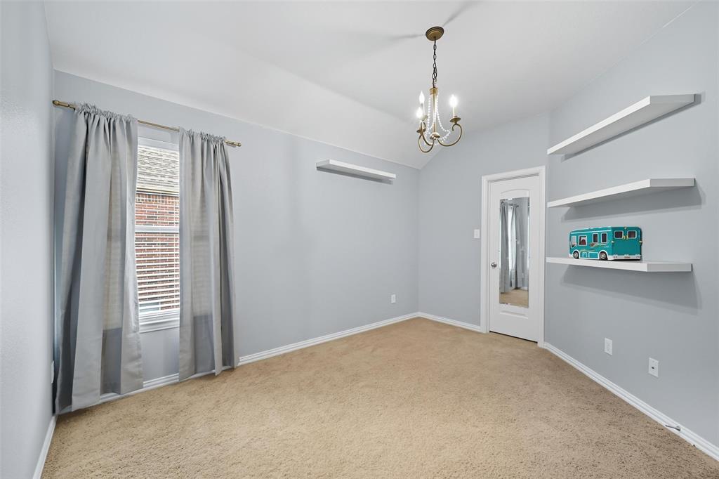 11577 Mansfield Drive Frisco, TX 75035 - Photo 29 of 37 a view of an empty room with a window