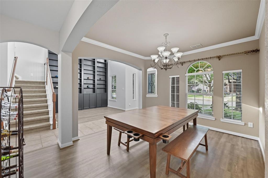 11577 Mansfield Drive Frisco, TX 75035 - Photo 8 of 37 a view of a dining room with furniture window and wooden floor