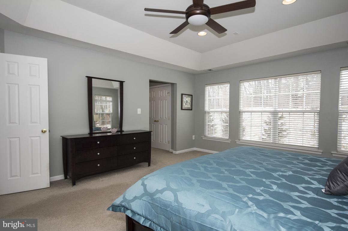 2044 Myrtlewood Road Baltimore, MD 21209 - Photo 14 of 30 a spacious bedroom with a bed and a dresser
