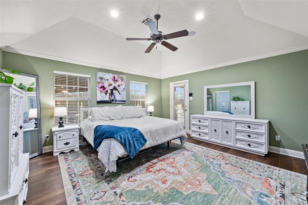 517 Chado Lane Robinson, TX 76706 - Photo 18 of 40 Primary Bedroom featuring dark wood finished floors, ceiling fan, vaulted ceiling, recessed lighting, and ornamental molding