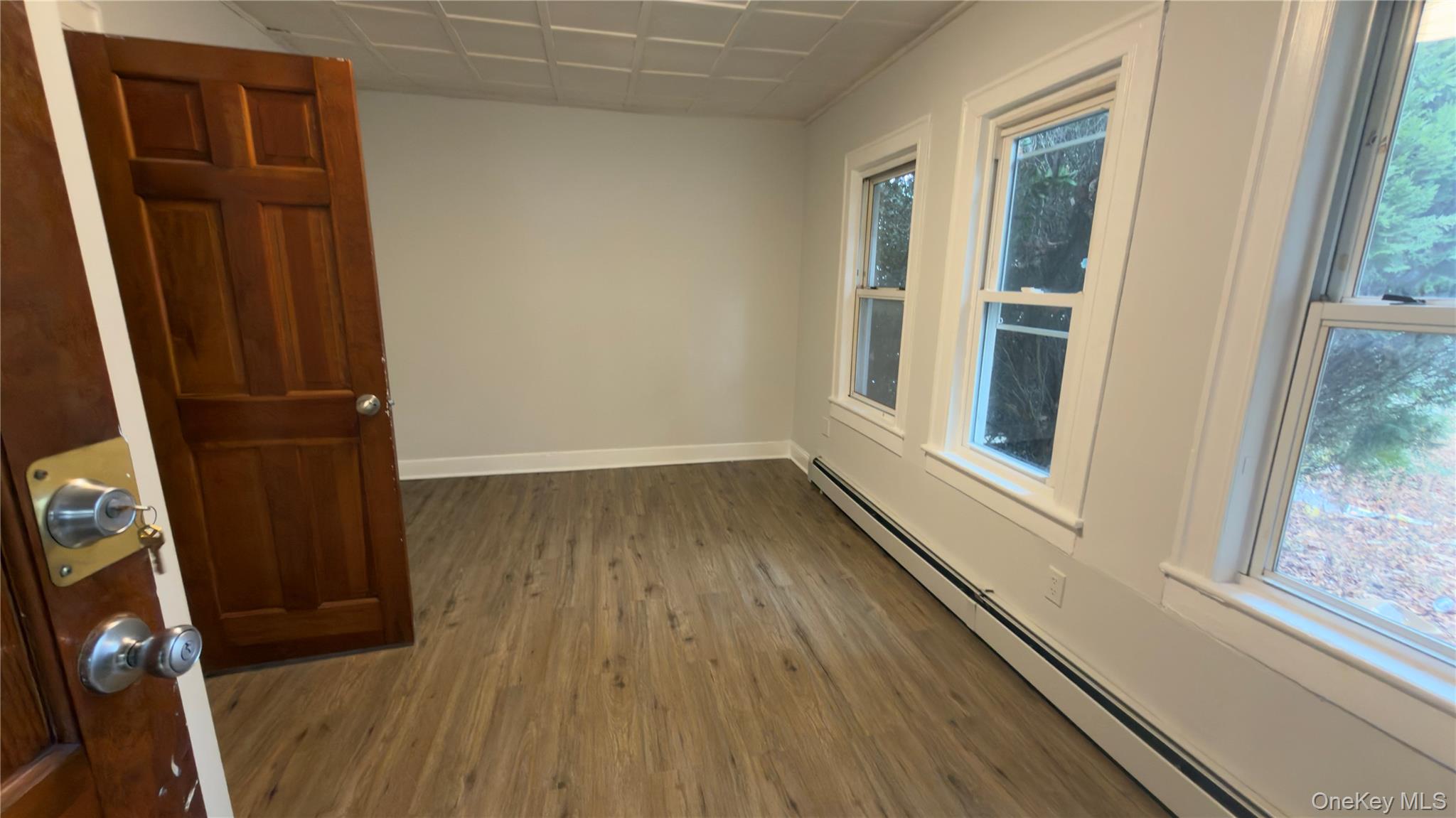 225 Church Street, Unit 2 Freeport, NY 11520 - Photo 15 of 18 wooden floor in an empty room