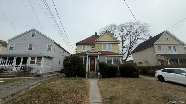 a front view of a house with a yard