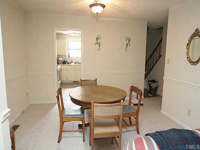 5416 Ridgeloch Place Raleigh, NC 27612 - Photo 3 of 5 a view of a room with furniture and wooden floor