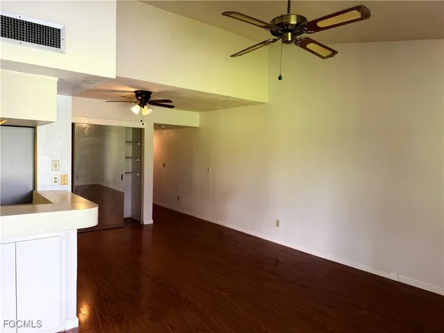 a utility room with shower and mirror