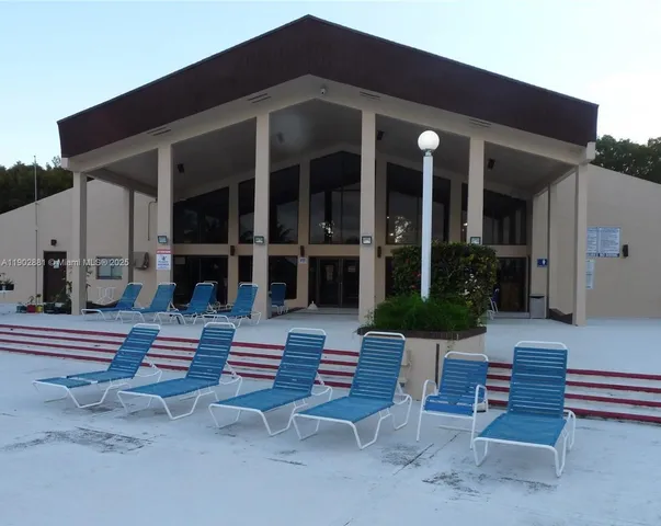 a backyard of a house with outdoor seating