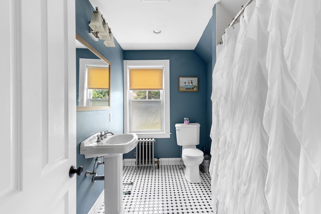 1012 Washington Street Whitman, MA 02382 - Photo 30 of 37 a bathroom with a sink toilet and shower