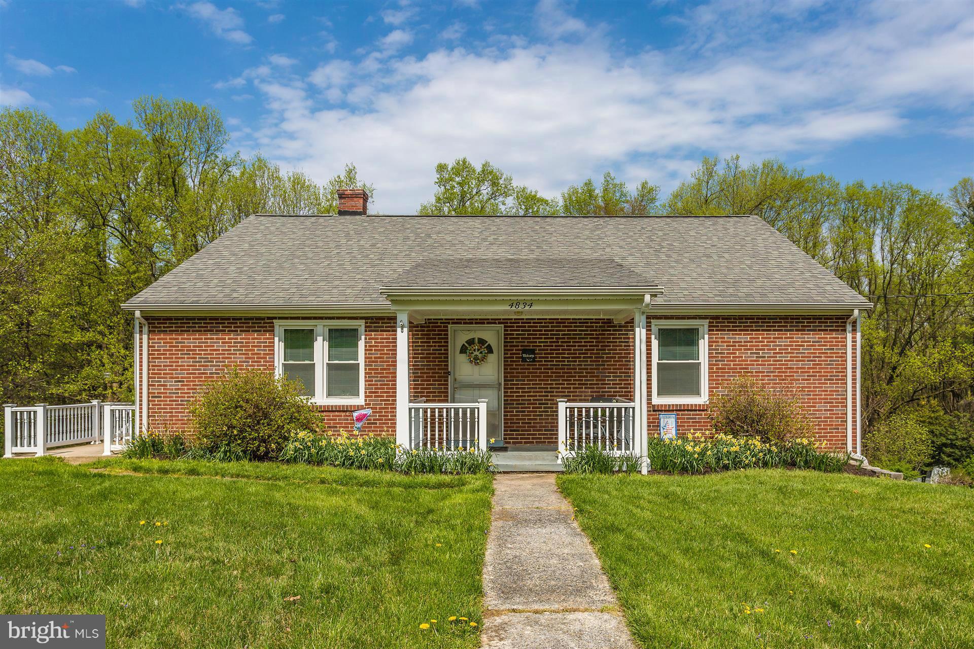 4834 Old Swimming Pool Road Frederick, MD 21703 - Photo 1 of 27 a view of a house with garden and yard