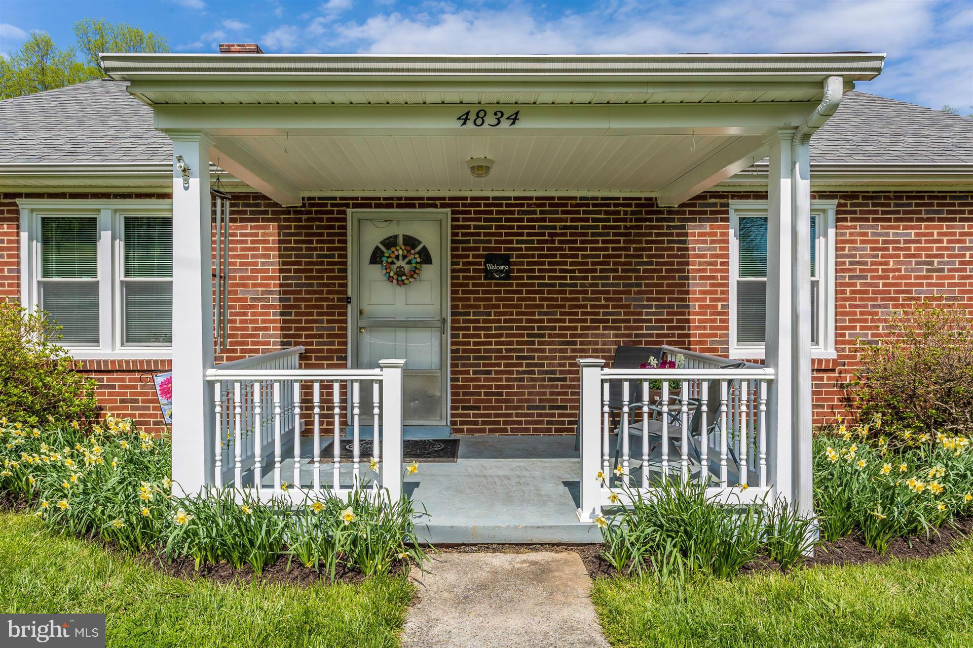 4834 Old Swimming Pool Road Frederick, MD 21703 - Photo 2 of 27 a front view of a house with plants