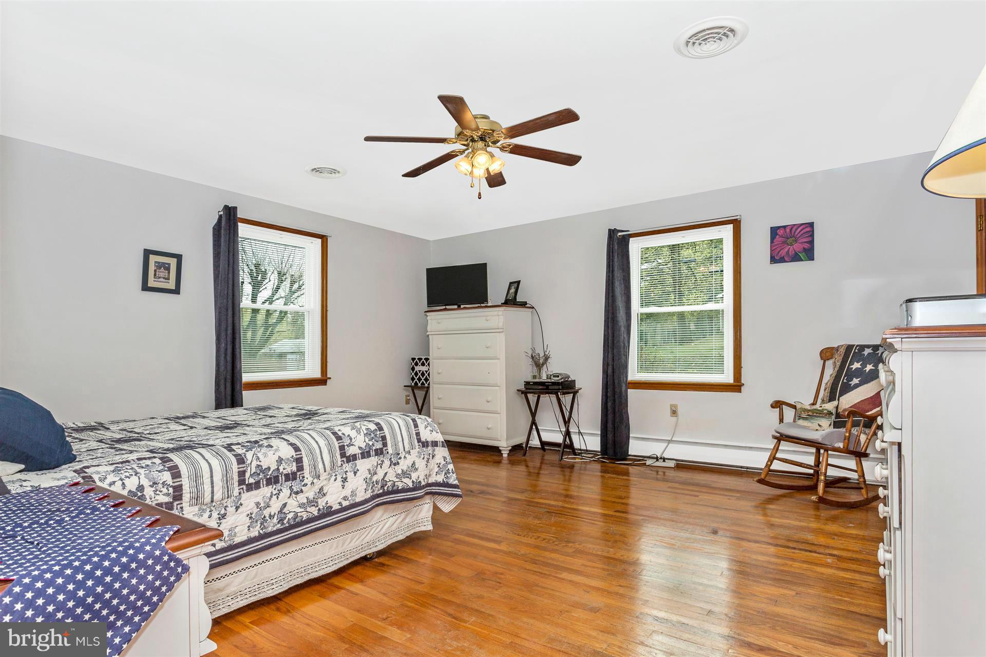 4834 Old Swimming Pool Road Frederick, MD 21703 - Photo 11 of 27 a bedroom with a bed and a chandelier