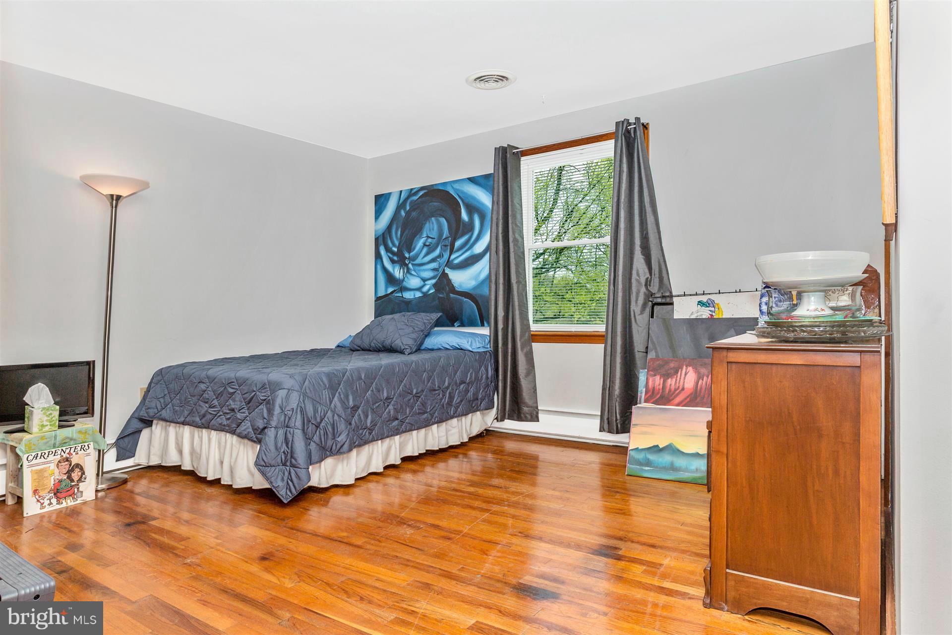 4834 Old Swimming Pool Road Frederick, MD 21703 - Photo 13 of 27 a bedroom with a bed and wooden floor