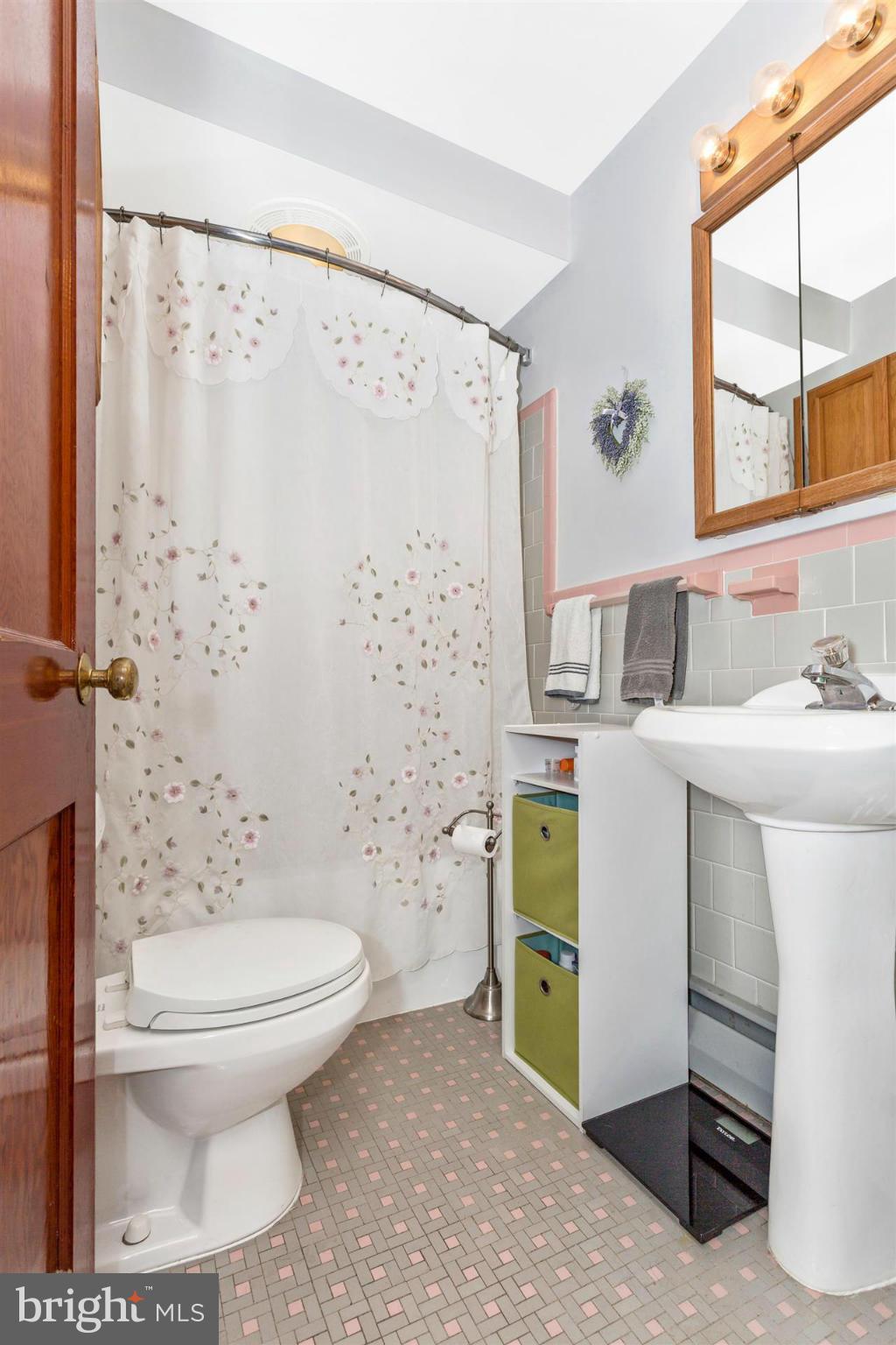 4834 Old Swimming Pool Road Frederick, MD 21703 - Photo 14 of 27 a bathroom with a sink toilet and shower