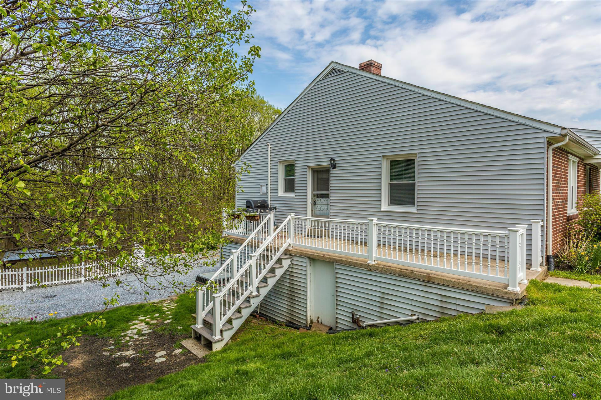 4834 Old Swimming Pool Road Frederick, MD 21703 - Photo 18 of 27 a front view of a house with a yard