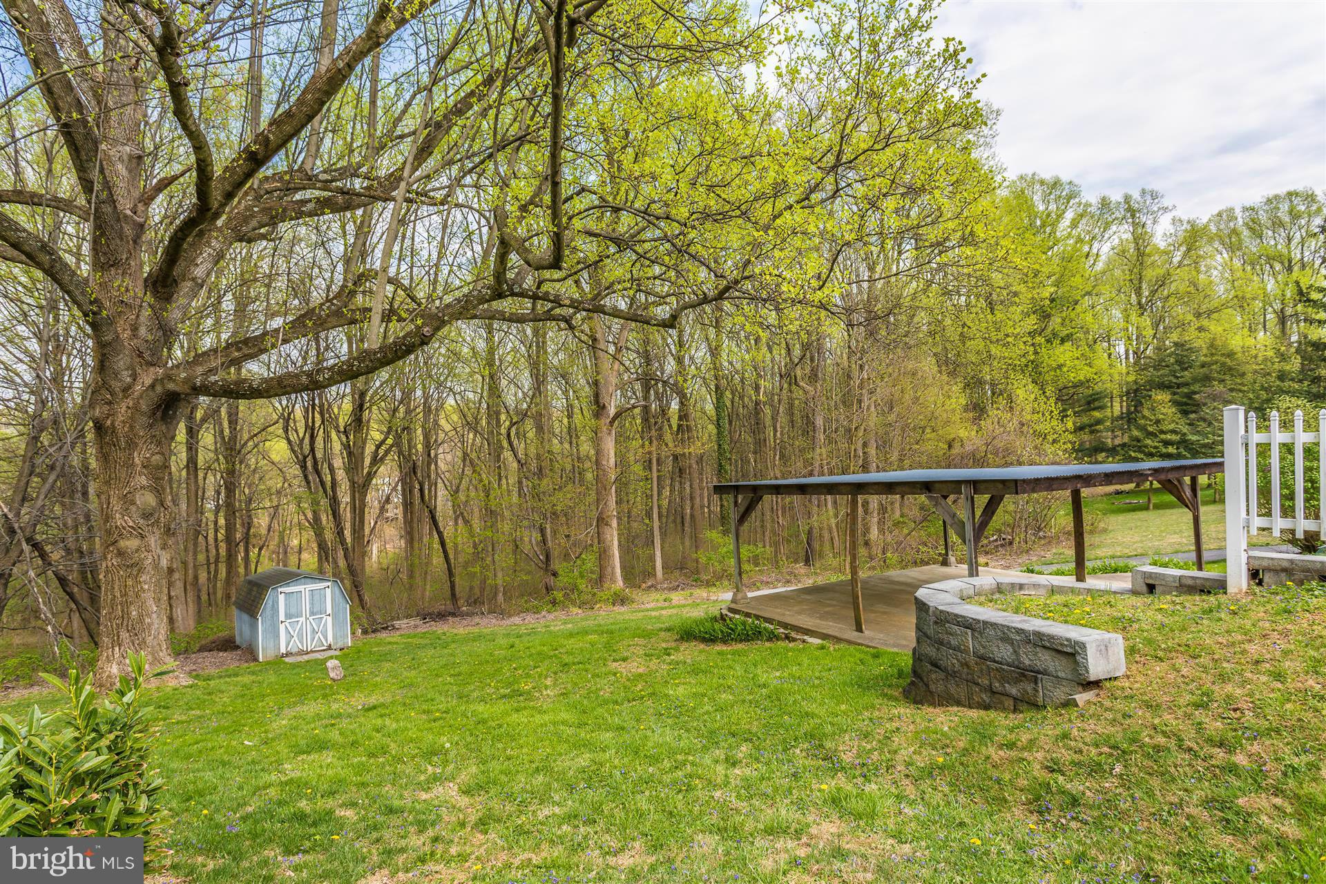 4834 Old Swimming Pool Road Frederick, MD 21703 - Photo 20 of 27 a view of a swimming pool with a garden