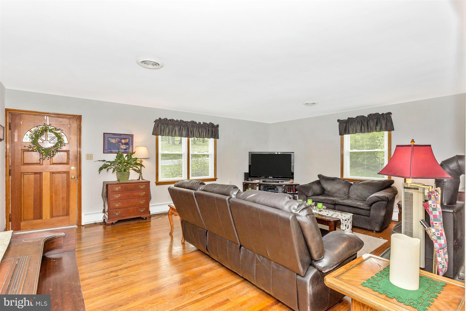 4834 Old Swimming Pool Road Frederick, MD 21703 - Photo 6 of 27 a living room with furniture and a flat screen tv