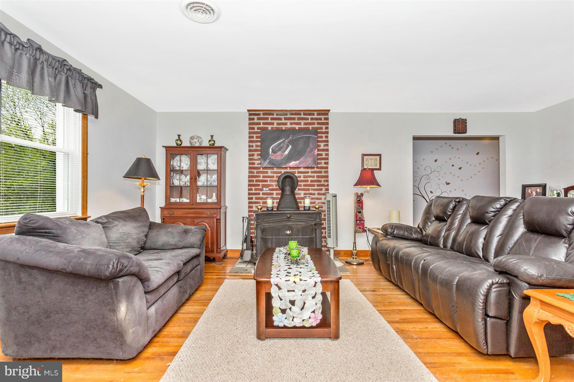 4834 Old Swimming Pool Road Frederick, MD 21703 - Photo 7 of 27 a living room with furniture and a large window