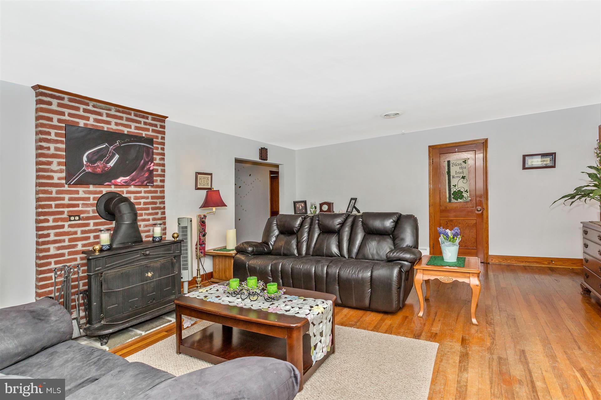 4834 Old Swimming Pool Road Frederick, MD 21703 - Photo 8 of 27 a living room with furniture and wooden floor