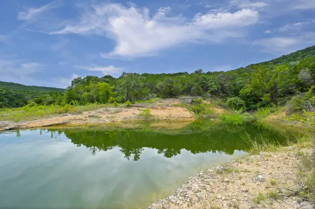 a view of a lake with a yard