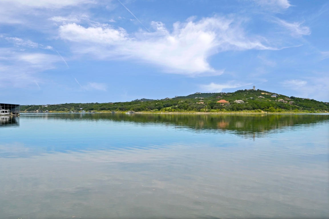 9006 Lime Creek Road Leander, TX 78641 - Photo 2 of 18 a view of a lake with houses in the back