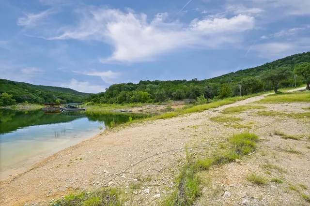 a view of a lake with a house in the background