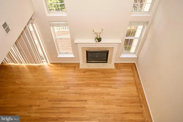 a view of a livingroom with an empty space and a fireplace