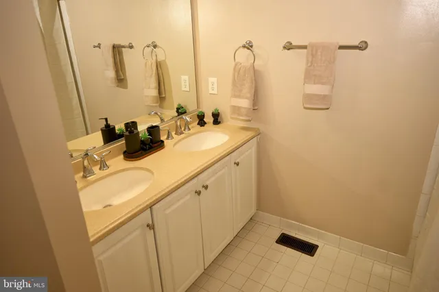 a bathroom with a sink and mirror