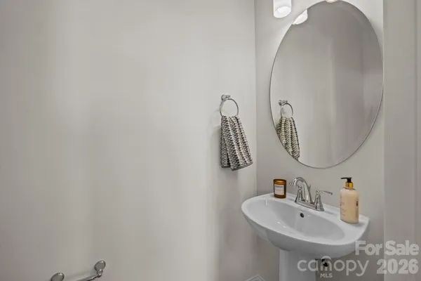 a bathroom with a sink and mirror