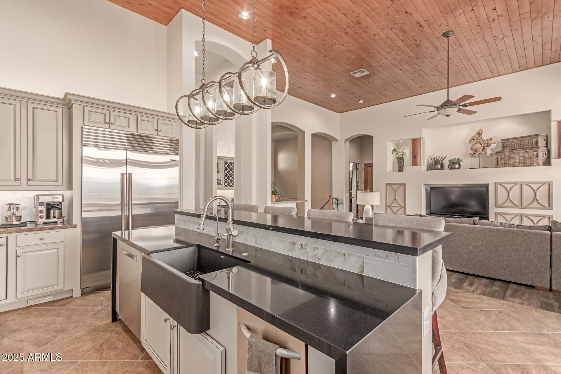 4317 North Brighton Circle Mesa, AZ 85207 - Photo 17 of 76 a kitchen with stainless steel appliances granite countertop a sink a stove and a refrigerator