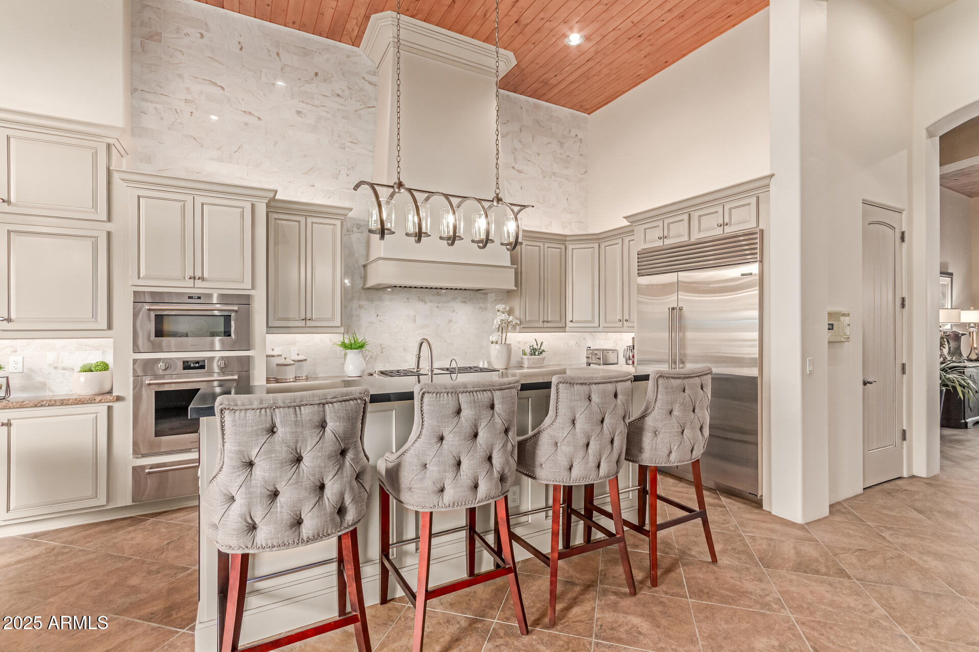4317 North Brighton Circle Mesa, AZ 85207 - Photo 18 of 76 a kitchen with stainless steel appliances a table and chairs in it