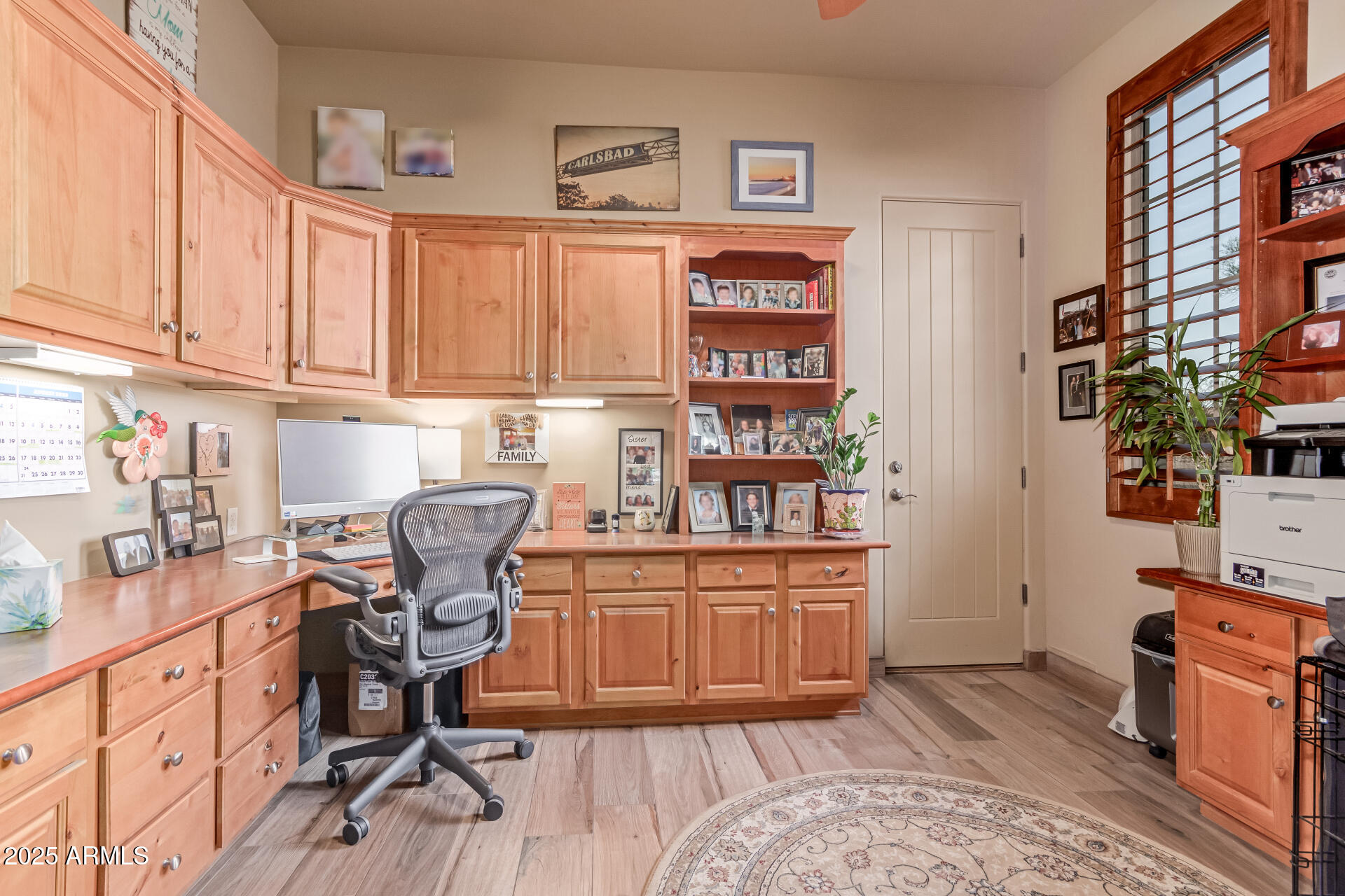 4317 North Brighton Circle Mesa, AZ 85207 - Photo 22 of 76 a view of a workspace with furniture and cabinets