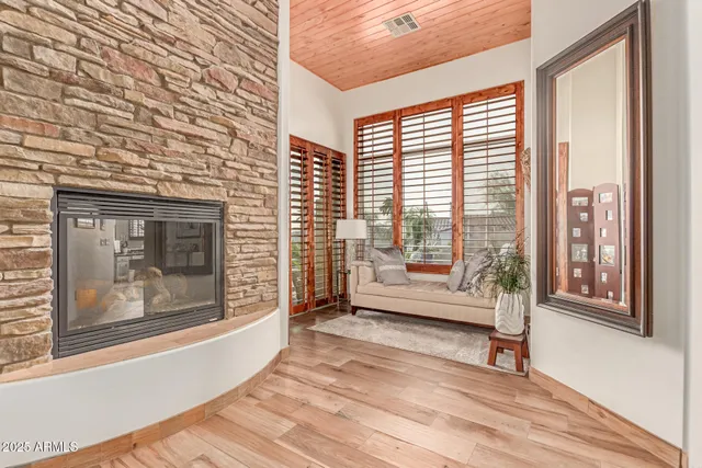 a view of a bedroom with bed and window