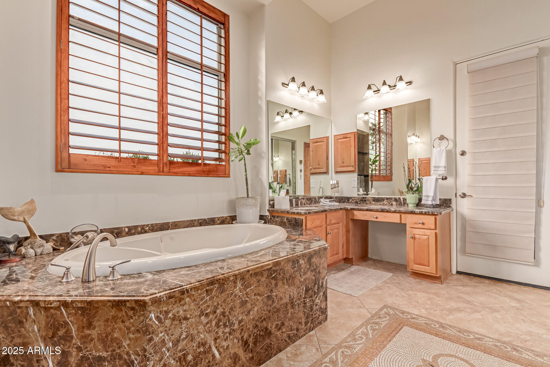 4317 North Brighton Circle Mesa, AZ 85207 - Photo 27 of 76 a bathroom with a tub sink and mirror
