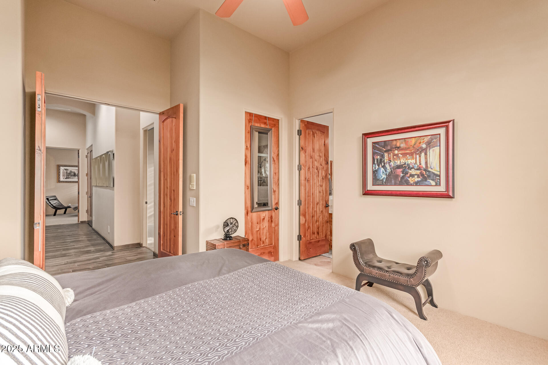 4317 North Brighton Circle Mesa, AZ 85207 - Photo 34 of 76 a bedroom with a bed and a chandelier