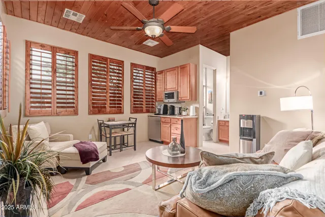 a view of a house with swimming pool and sitting area