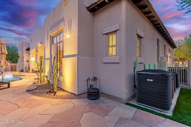an aerial view of residential houses with outdoor space and river