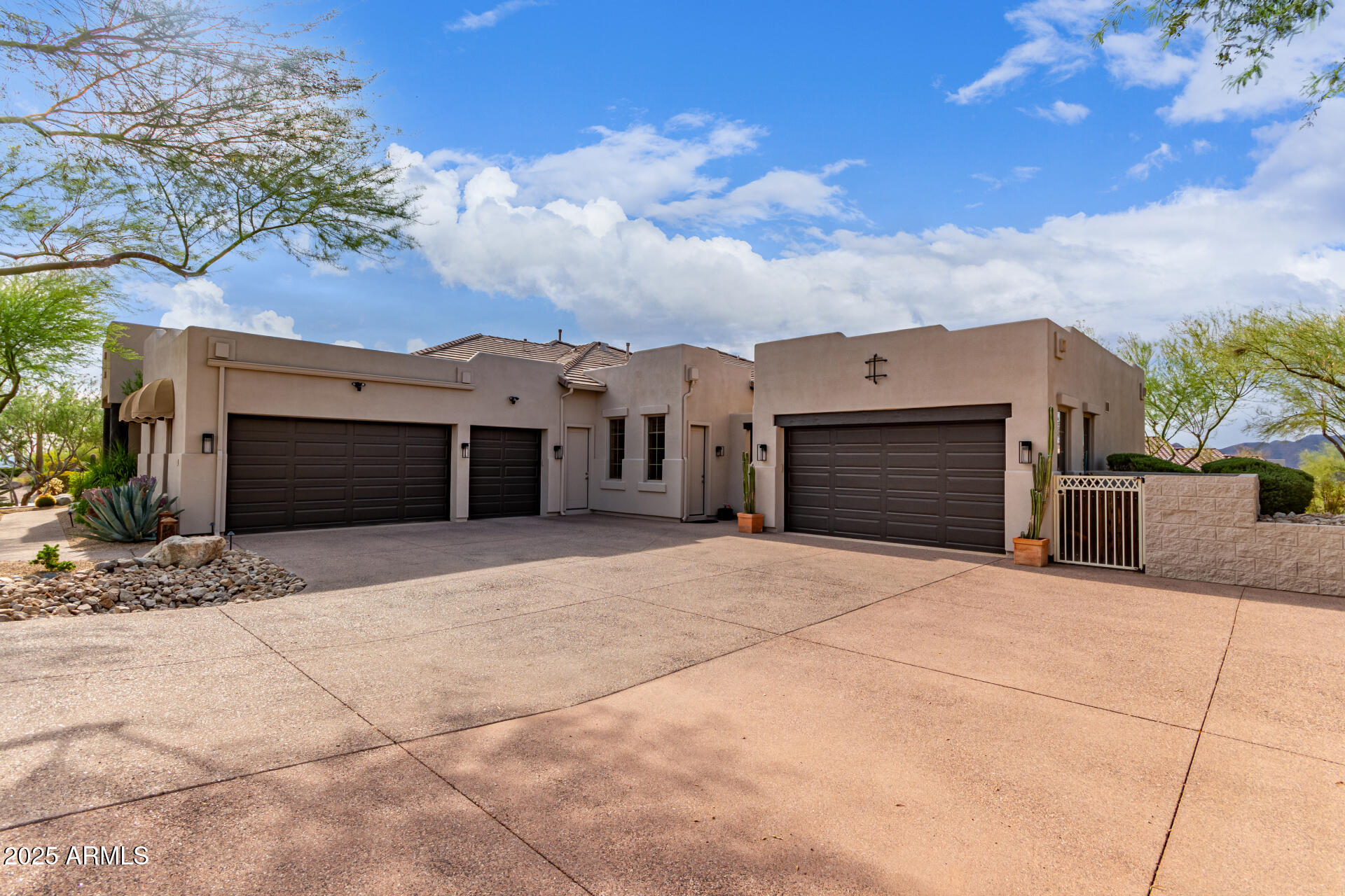 4317 North Brighton Circle Mesa, AZ 85207 - Photo 6 of 76 a front view of a house with a yard and garage