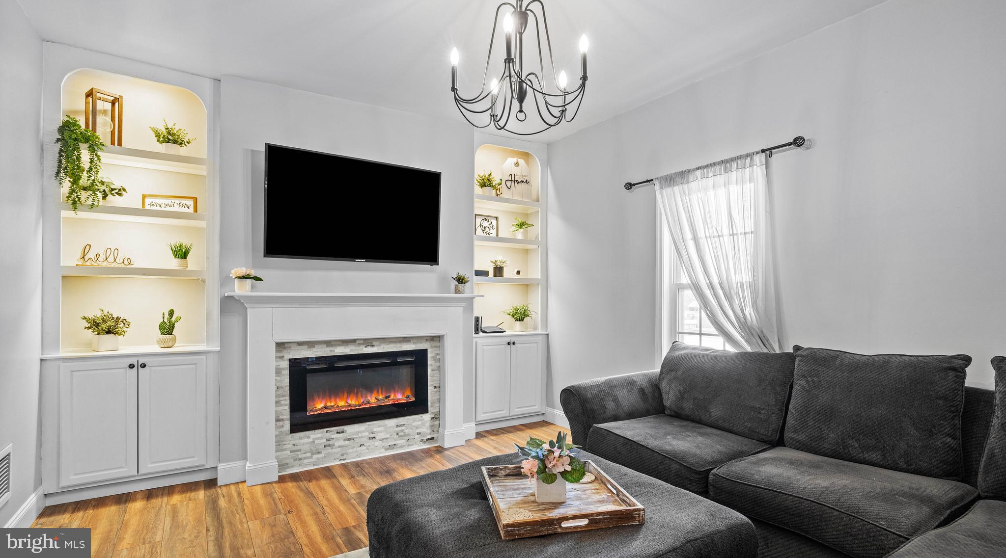 197 Ridge Street Smokerun, PA 16681 - Photo 16 of 47 a living room with furniture a fireplace and a flat screen tv