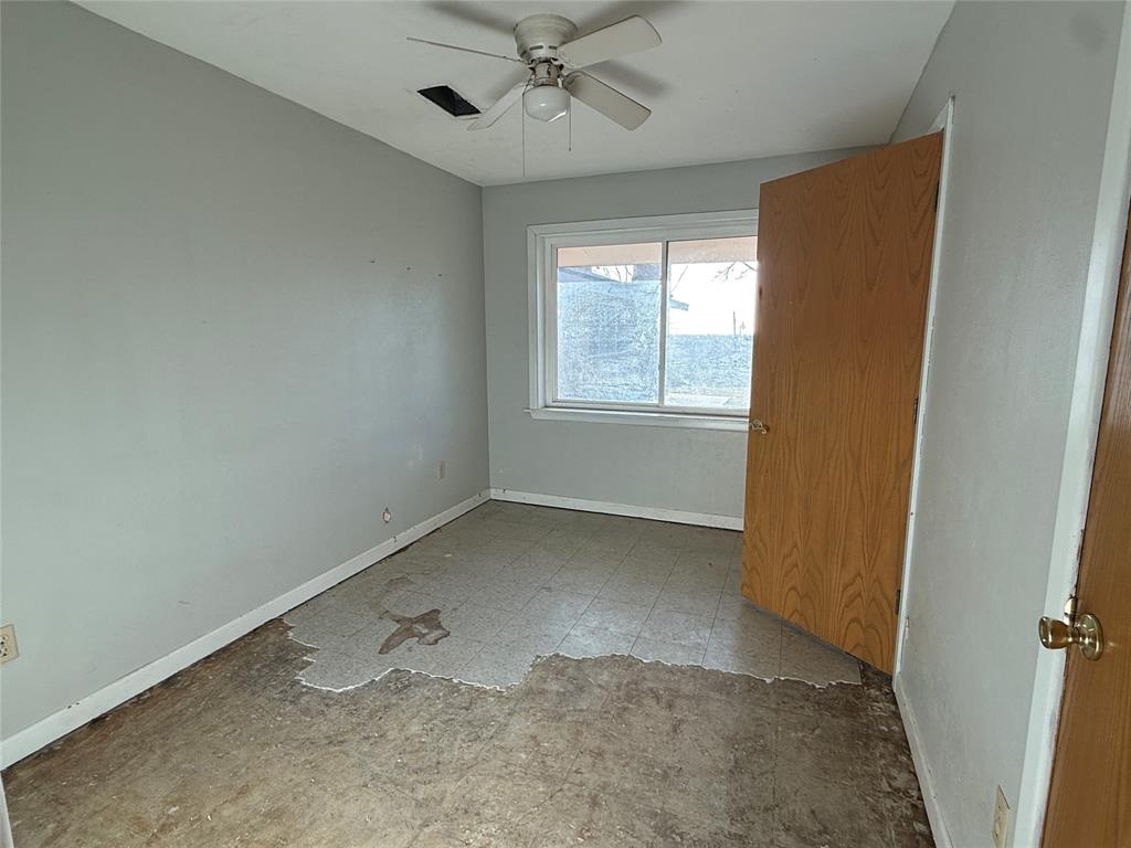 12703 Farm To Market 59 Athens, TX 75751 - Photo 17 of 40 an empty room with windows and fan